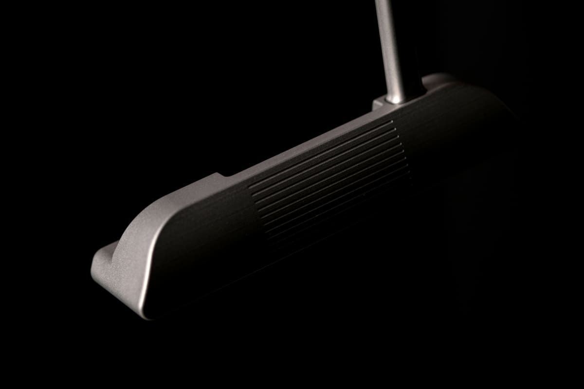 Macro close-up of myvicto B-Serie blade putter face showing loft angle